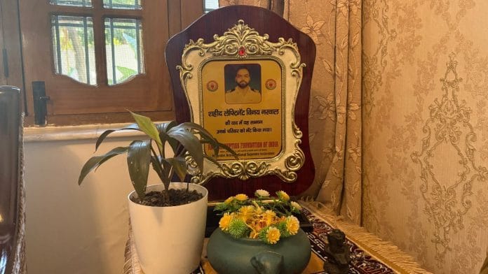 In the living room of the family's Karnal home, a corner has been turned into a small memorial | Photo: Sakshi Mehra, ThePrint