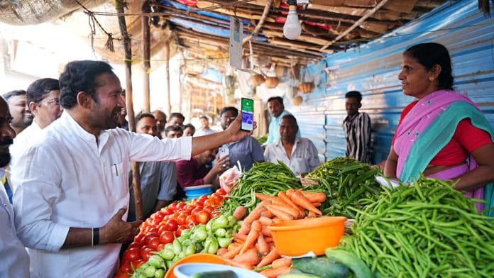 Union Minister For Culture, Tourism And DoNER G. Kishan Reddy makes a payment through the Unified Payments Interface (UPI) to a vegetable seller at a roadside market, at Jubilee Hills, in Hyderabad | ANI Photo