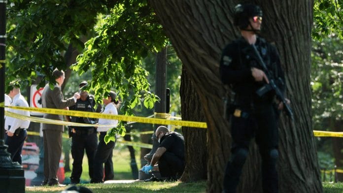 A US Secret Service crime scene investigator works at the scene of an officer-involved shooting in Washington, D.C., U.S., May 4, 2026. | REUTERS/Jonathan Ernst