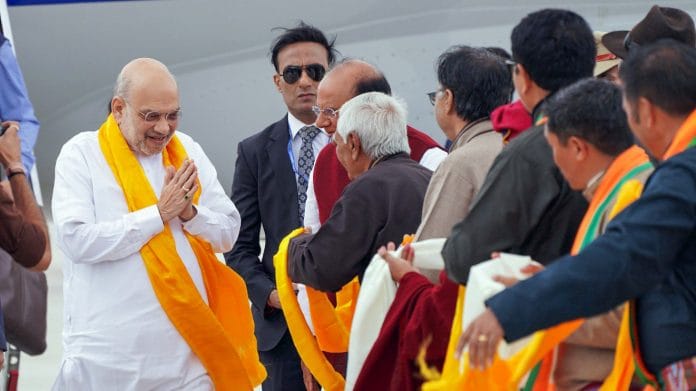 Union Home Minister Amit Shah receives a warm welcome by Ladakh Lieutenant Governor Vinai Kumar Saxena and other dignitaries upon his arrival at the airport, in Leh on Thursday. | @lg_ladakh/ANI Photo