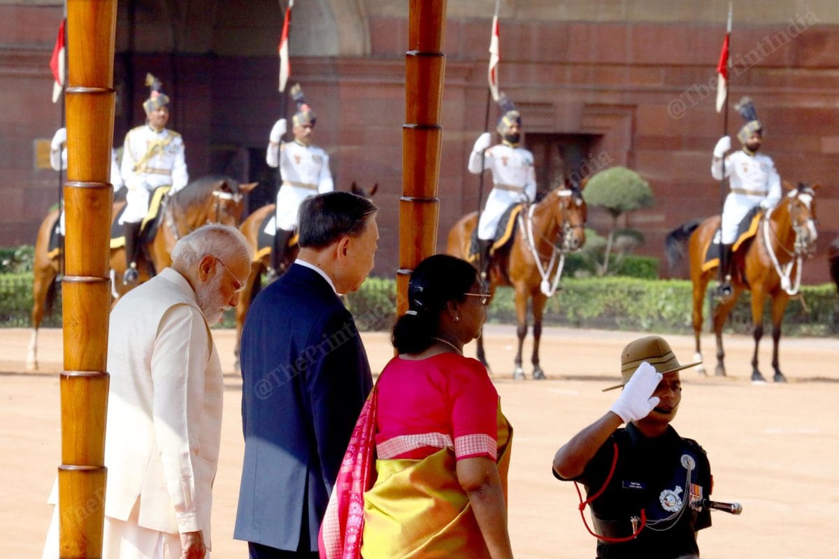  PM Modi (L), Vietnam's President To Lam (C) President Murmu (R) inspect the guard of honour | Praveen Jain | ThePrint