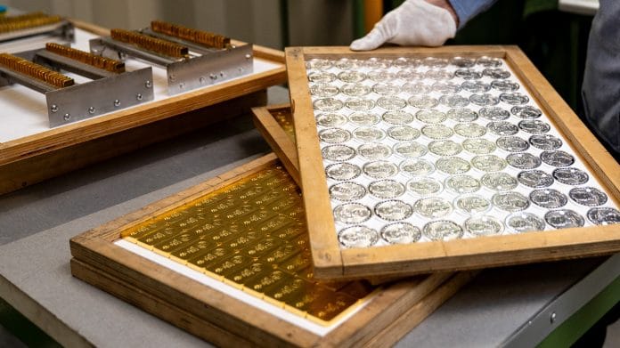 Trays of silver coins and gold bars at the Polish mint, also known as Mennica Polska SA, in Warsaw, Poland, on Thursday, Feb. 12, 2026. Polands central bank, the worlds biggest reported buyer of gold, is boosting purchases by another 150 tons as it braces for more of the geopolitical instability that has driven prices to record highs. Photographer: Damian Lemanski/Bloomberg
