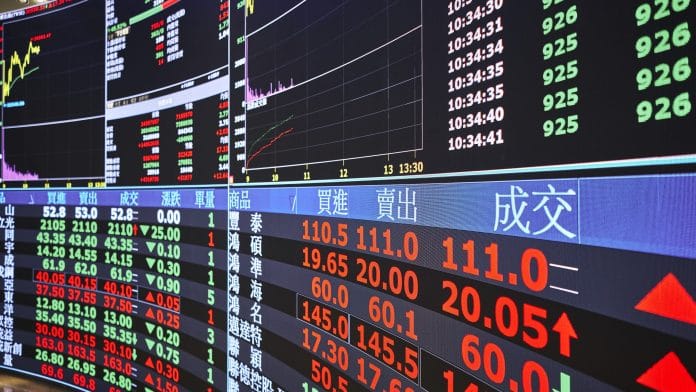 Stock market information displayed at the Taiwan Stock Exchange Corp. headquarters in Taipei, Taiwan, on Tuesday, May 6, 2025. The Taiwan dollar surged as much as 4.8% on Monday, fueled by concerns over the US dollars outlook and speculation that Taiwan may let its currency gain as it seeks a trade deal with the US. | Photographer: An Rong Xu/Bloomberg
