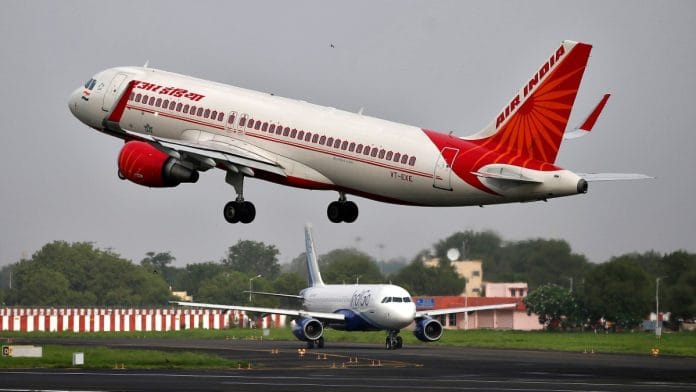 Representational | File photo of Air India Airbus A320-200 aircraft taking off as an IndiGo Airlines aircraft waits for clearance at Sardar Vallabhbhai Patel International Airport in Ahmedabad on 7 July 2017 | Amit Dave/Reuters
