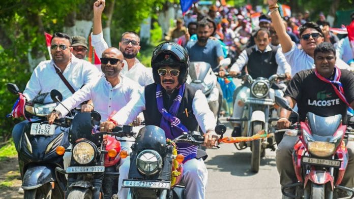 Asom Gana Parishad (AGP) president Atul Bora with his supporters during a bike rally part of the election campaign in Assam’s Bokakhat, the constituency he is fighting from, earlier this month | Photo: ANI