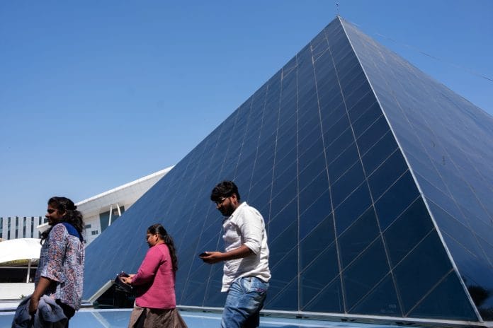 Employees walk past the K. Dinesh Communication Design Center at the Infosys Ltd. campus in the Electronics City information technology hub in Bengaluru, India, on Thursday, Jan. 10. 2019. Asias largest software outsourcing provider that is wrestling with clients' changing technology needs and a shift toward automation reports quarterly profits on Nov. 11. Photographer: Karen Dias/Bloomberg