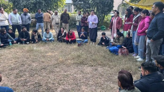 Candidates who failed to clear the subject knowledge exam of the HPSC for posts of English assistant professors outside the HPSC building in Panchkula | By special arrangement