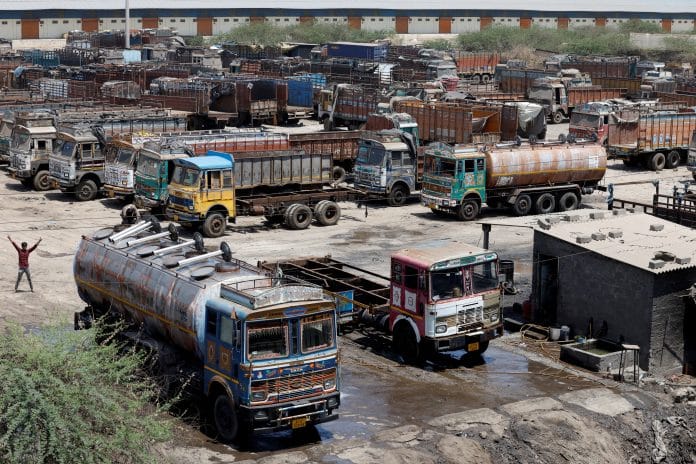 Trucks are parked at a parking area, as India faces rising oil prices following the closure of the Strait of Hormuz amid the U.S.-Israeli conflict with Iran, in Gandhidham , Gujarat, India, May 23, 2026. REUTERS/Amit Dave
