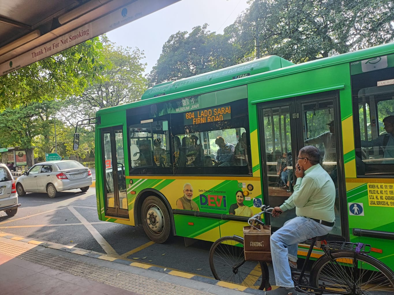 The green buses bear the ‘DEVi’ branding, flanked on either side by a picture of PM Narendra Modi and CM Rekha Gupta. | Akanksha Mishra | ThePrint