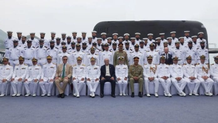 Pakistani and Chinese officials pose for a group photo during the commissioning ceremony of PNS Hangor in Sanya, China, on 30 April | Source: X, @PresOfPakistan)