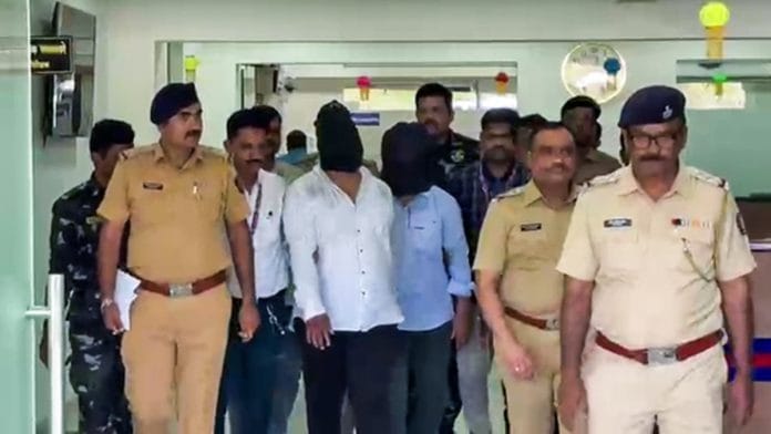 Two arrested accused in the case of deaths due to illicit liquor, being taken away by the Police in Pimpri-Chinchwad, in Pune on 29 May 2026 | ANI