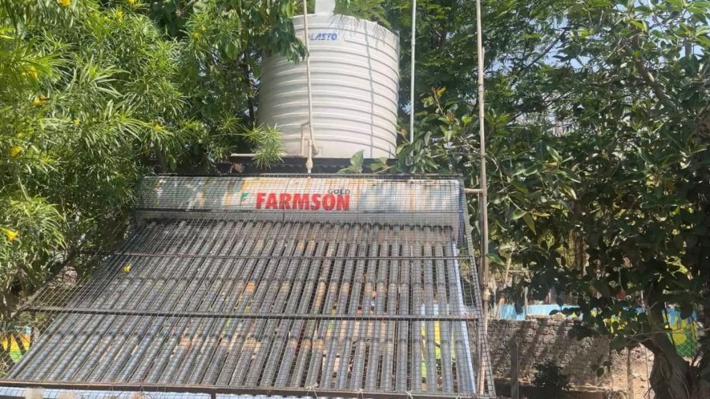 Water tanker fitted alongside solar panels to provide hot water to the villagers | Kasturi Walimbe