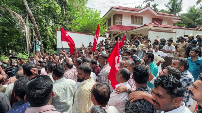 CPI(M) workers gather outside residence of ex-Kerala CM Pinarayi Vijayan as ED raids the residence. | ANI