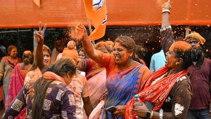 BJP supporters celebrate the party's West Bengal win, in Nadia on 4 May | Photo: PTI