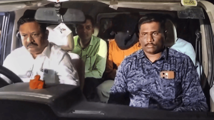 CBI officials take accused Shubham Khairnar into custody in connection with the NEET-UG 2026 paper leak case, in Nashik on Tuesday | PTI
