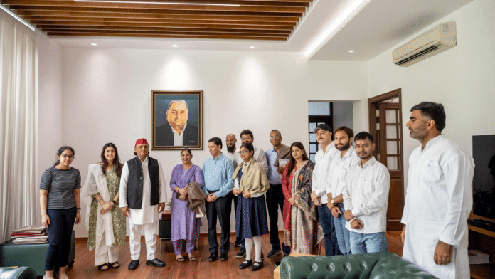 Samajwadi Party chief Akhilesh Yadav (third from left) with meritorious students in Lucknow | X/@yadavakhilesh