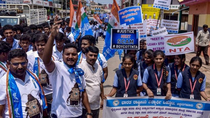NSUI activists protest against the NEET-UG 2026 paper leak, in Karnataka's Chikkamagaluru | Photo: PTI