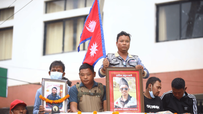 Relatives carry photographs of their loved ones killed in the Gen Z uprising in Nepal | Manisha Mondal | ThePrint File Photo