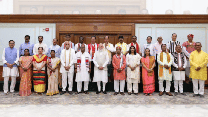 Prime Minister Narendra Modi with representatives of the Janjati Suraksha Manch (Photo/@narendramodi)
