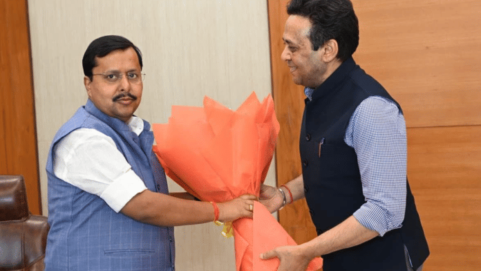 The now deleted picture of BJP chief Nitin Nabin with Sanjay Prasad, Additional Chief Secretary to the Uttar Pradesh CM | X