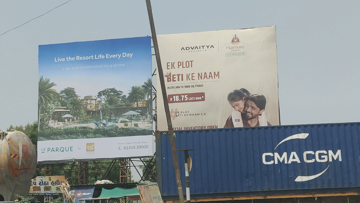 Housing billboards near Sanand cluster. Multi-storey housing is under construction for thousands of workers arriving from other states | Vrinda Tulsian/ThePrint 