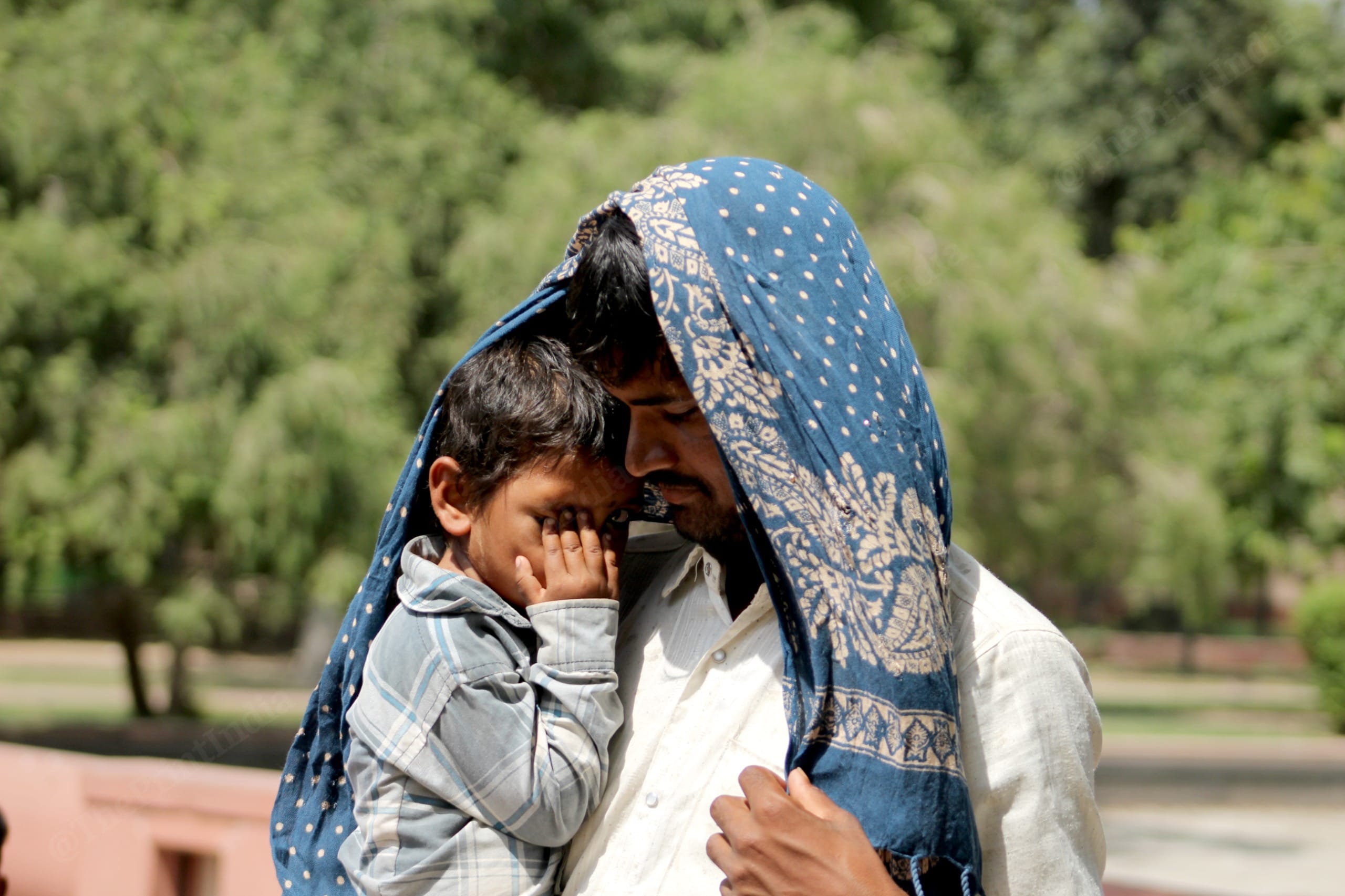 As heatwave conditions persist in the national capital, Delhiites near India Gate seen shielding themselves from the scorching Sun. | Nikitha Arathi Naveen | ThePrint