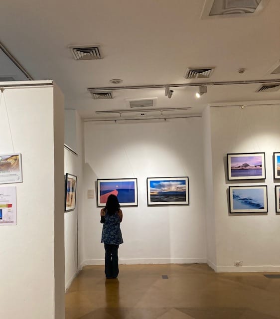 A visitor stands at the centre of a photograph that portrays in-camera double exposure. ‘Two realities meet in one image’ | Photo: Preksha | ThePrint