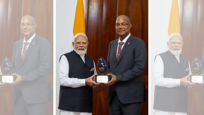 Prime Minister Narendra Modi is conferred the 'Guardian of the Blue Horizon', Seychelles' highest distinction for leadership in environmental conservation and sustainable development, by Seychelles President Patrick Herminie, in Victoria on Sunday. (DPR PMO/ANI Photo)