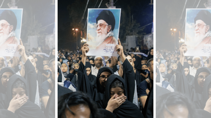 Members of the Shia Muslim community hold portraits of Ayatollah Ali Khamenei during a Matam procession to commemorate him in Delhi, India, on March 10. | Bloomberg