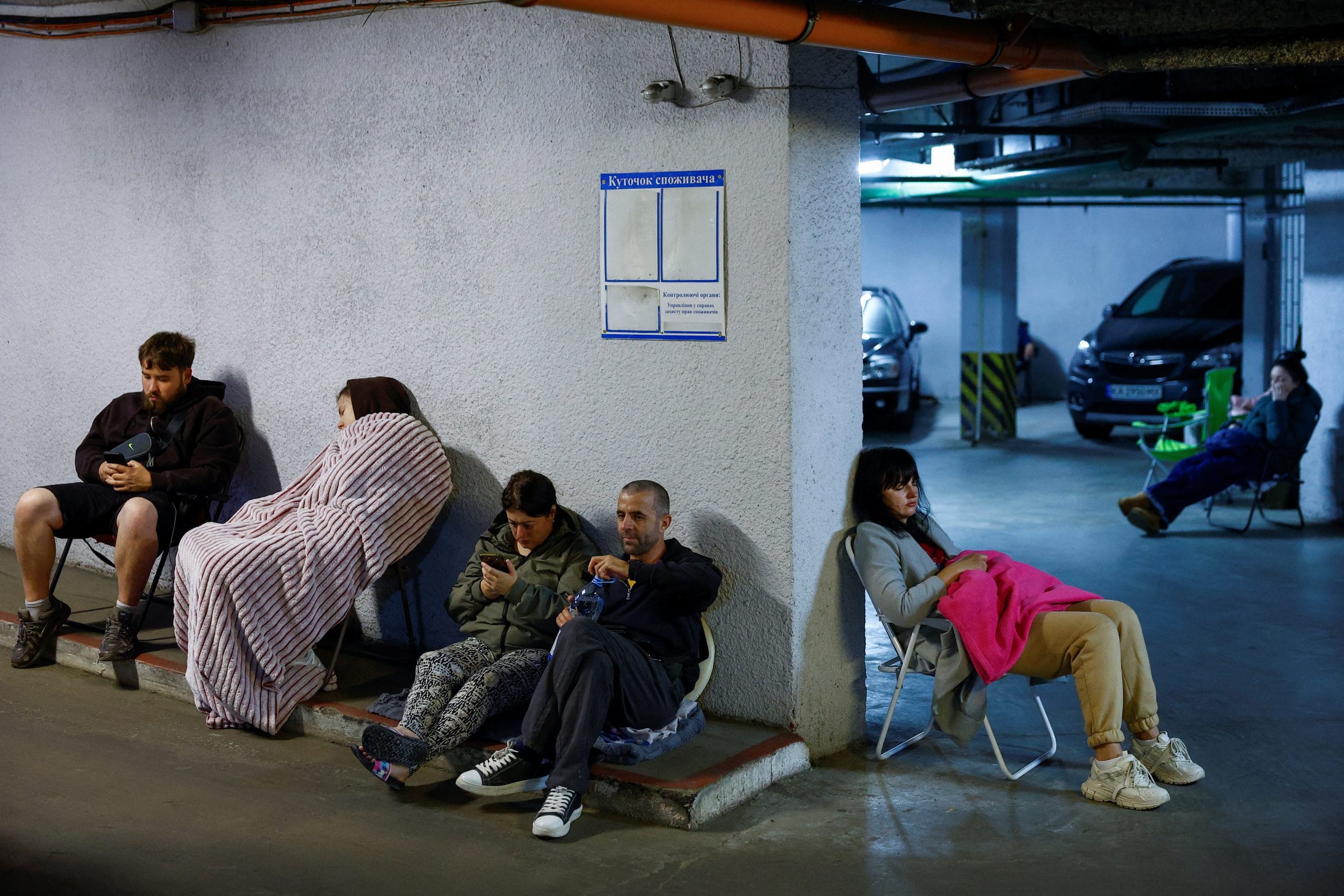 Residents take shelter inside an underground parking during Russian missile and drone strikes, amid Russia's attack on Ukraine, in Kyiv, Ukraine June 15, 2026. REUTERS/Valentyn Ogirenko
