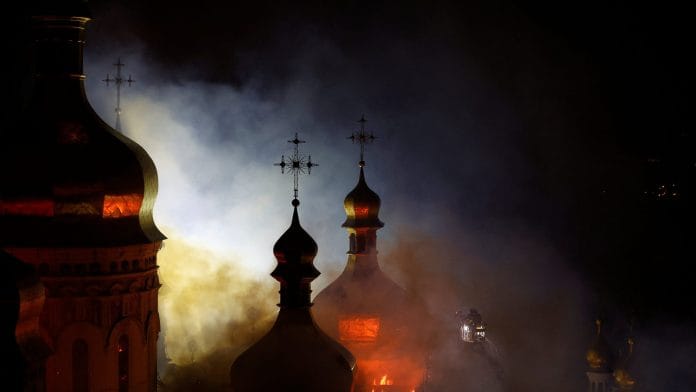 The Dormition Cathedral of the Kyiv Pechersk Lavra burns after it was hit during Russian missile and drone strikes, amid Russia's attack on Ukraine, in Kyiv, Ukraine June 15, 2026. REUTERS/Valentyn Ogirenko