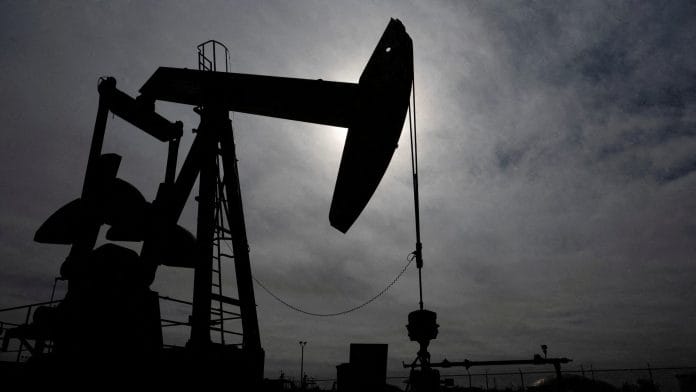 FILE PHOTO: A pump jack operates near a crude oil reserve in the Permian Basin oil field near Midland, Texas, U.S. February 18, 2025. REUTERS/Eli Hartman/File Photo
