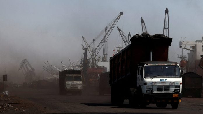 FILE PHOTO: Trucks loaded with coal drive to the coal yard at the Deendayal Port in Kandla, in the western state of Gujarat, India Amit Dave | File Photo | REUTERS