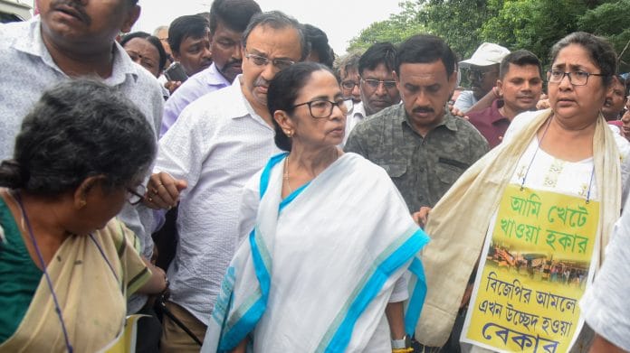 Kolkata, Jun 17 (ANI): TMC supremo Mamata Banerjee led a march rally in protest against hawker evictions at Wellington, in Kolkata on Wednesday. (ANI Photo)