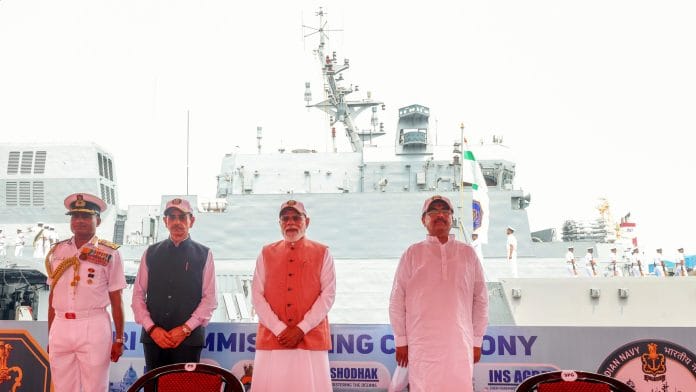 Kolkata, Jun 21 (ANI): Prime Minister Narendra Modi during the Tri-Commissioning Ceremony of Dunagiri, Sanshodhak & Agray at Syama Prasad Mookerjee Port, in Kolkata on Sunday. West Bengal Governor R.N. Ravi, Chief Minister Suvendu Adhikari, and Chief of the Naval Staff, Admiral Krishna Swaminathan also present. (DPR PMO/ANI Photo)