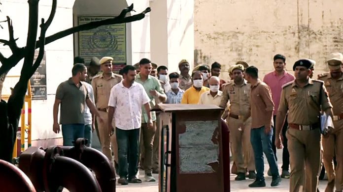 Ram Mandir donations alleged embezzlement case, following the court hearing, the eight accused are being taken away from the special court, in Ayodhya on Friday. | ANI Video Grab
