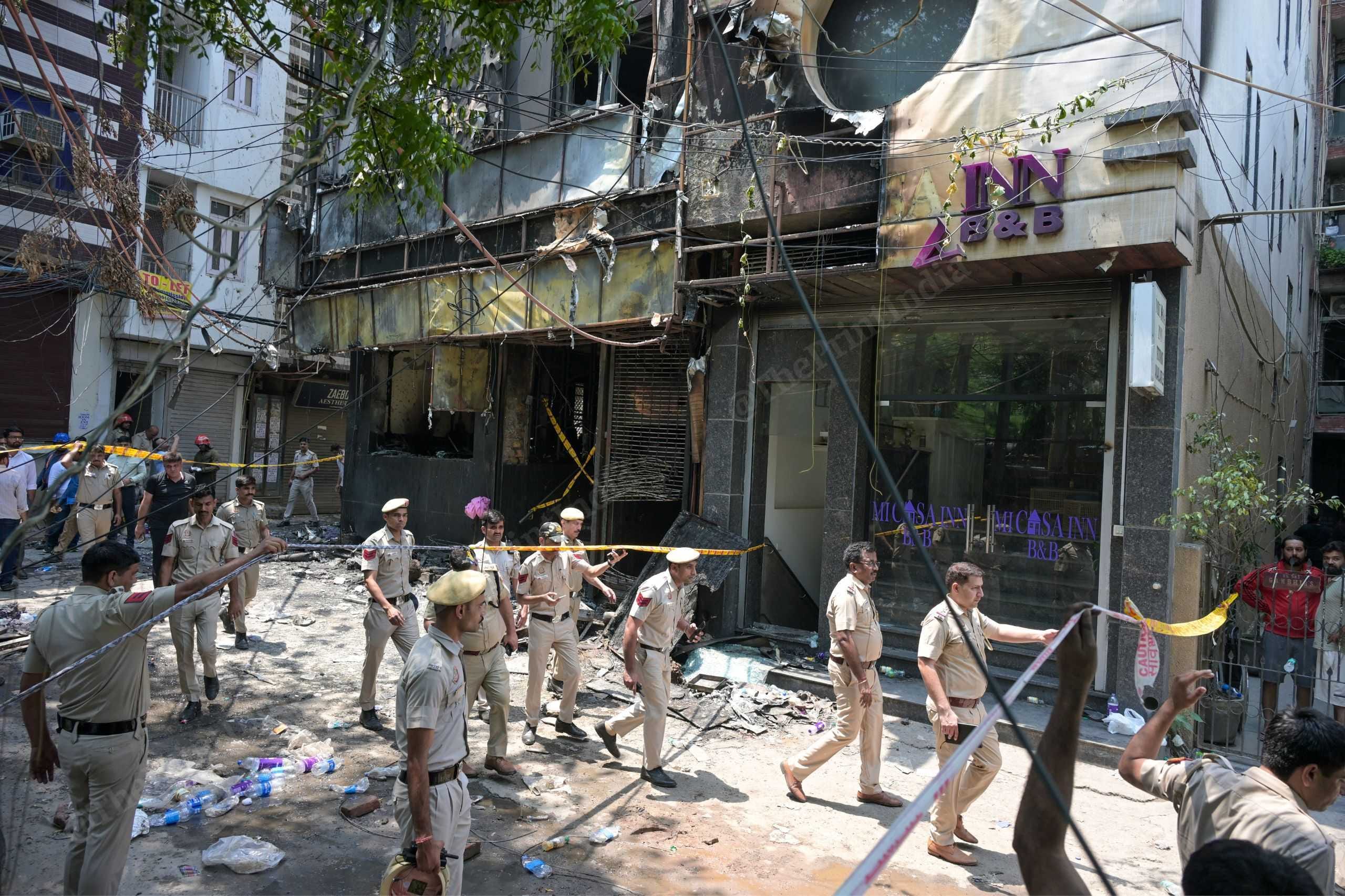 Delhi Police personnel outside Bed & Breakfast in Malviya Nagar where fire claimed 21 lives, on 3 June 2026 | Suraj Singh Bisht/ThePrint
