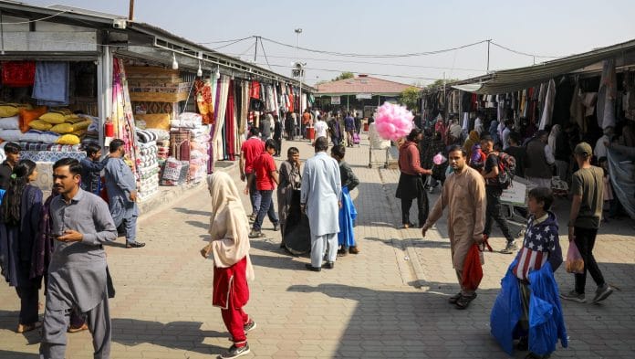 Shoppers at a market in Islamabad, Pakistan | Bloomberg
