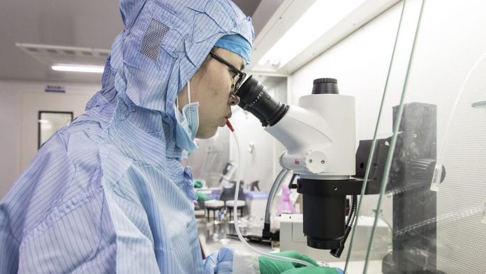 A lab technician uses a microscope and a special tool controlled with breathing to sort mouse embryos at a Cyagen Biosciences mouse breeding facility in Taicang, China on Monday, 18 March 2019. Qilai Shen | Bloomberg