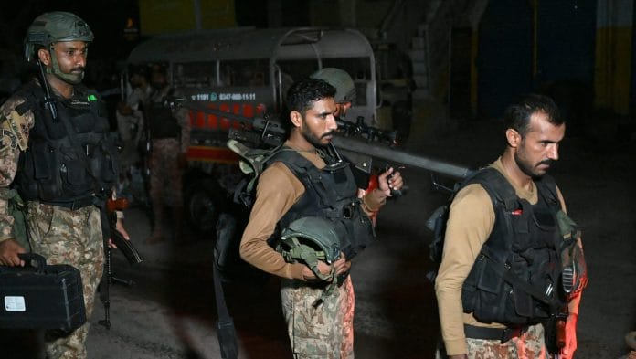 Paramilitary soldiers return after completing an operation following a militant attack on Pakistan's Security Rangers compound in Karachi on June 28. Photographer: Rizwan Tabassum/AFP/Getty Images | Bloomberg