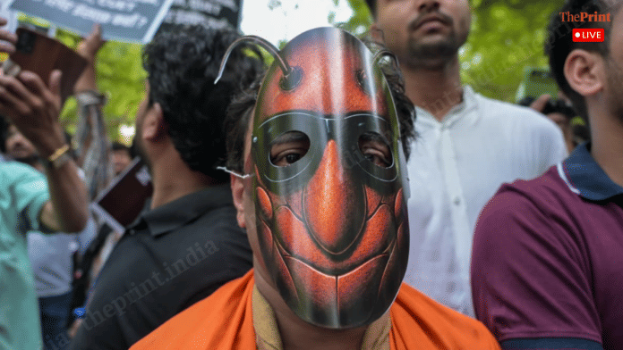 CJP supporter wearing cockroach mask at Jantar Mantar on 6 July 2026 | Photo: Suraj Singh Bisht, ThePrint