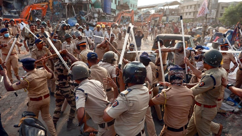 Police officials carry out a lathi charge after stone-pelting during demolition drive in Garib Nagar on 20 May 2026 | ANI
