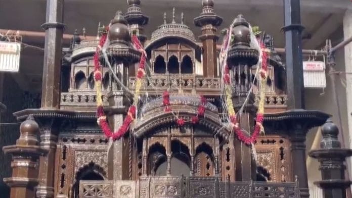 The tazia, a miniature replica of the mausoleum of Imam Hussain, is made up of Kashmiri walnut and Burma teak wood | Screengrab from PTI video