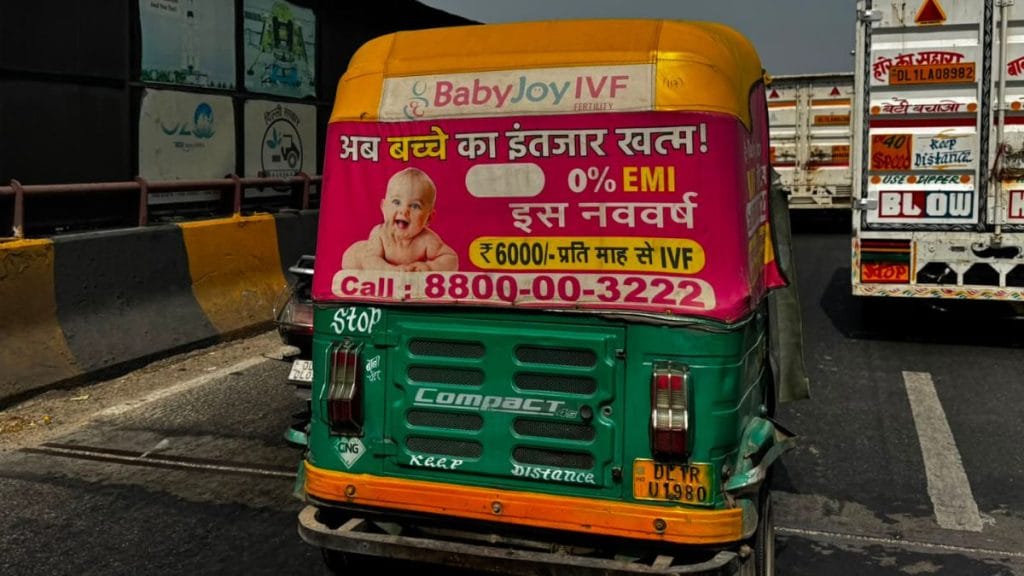 An autorickshaw in Delhi-NCR with an advertisement of an IVF clinic. Sagrika Kissu | ThePrint