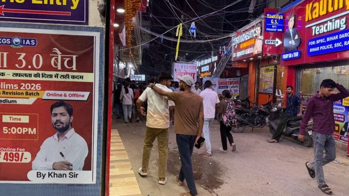 Students walk through Musallahpur Hat in Patna, where coaching institutes dominate the streetscape and Khan Sir's image is impossible to miss | Photo: Nootan Sharma | ThePrint