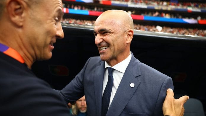 Portugal coach Roberto Martinez shakes hands with Uzbekistan coach Fabio Cannavaro before the match | Pedro Nunes | REUTERS