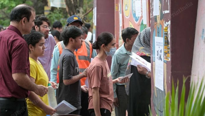 Candidates, accompanied by their families, arrive at an examination centre in New Delhi for the NEET UG re-examination Sunday | Suraj Singh Bisht