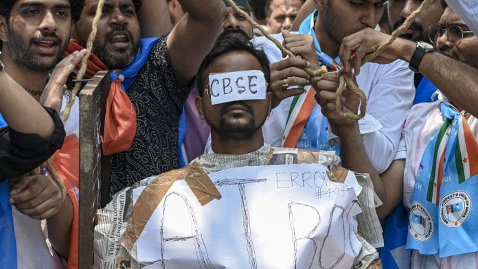 NSUI activists raise slogans during a protest, alleging irregularities in the Central Board of Secondary Education's (CBSE) On-Screen Marking (OSM) evaluation system, outside the board's headquarters at Patparganj, in New Delhi, Saturday, May 30, 2026. | PTI Photo