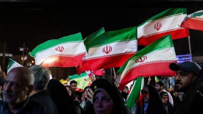 People wave Iranian flags during a rally in Tehran, Iran, May 29, 2026. Majid Asgaripour/WANA (West Asia News Agency) via REUTERS