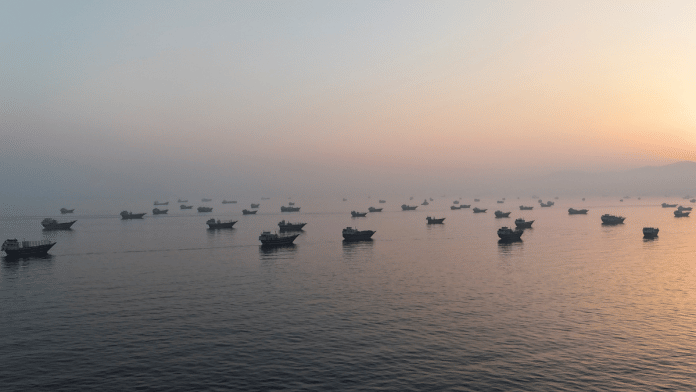A drone view shows vessels in the Strait of Hormuz, as seen from Musandam, Oman, on 15 June. | Reuters